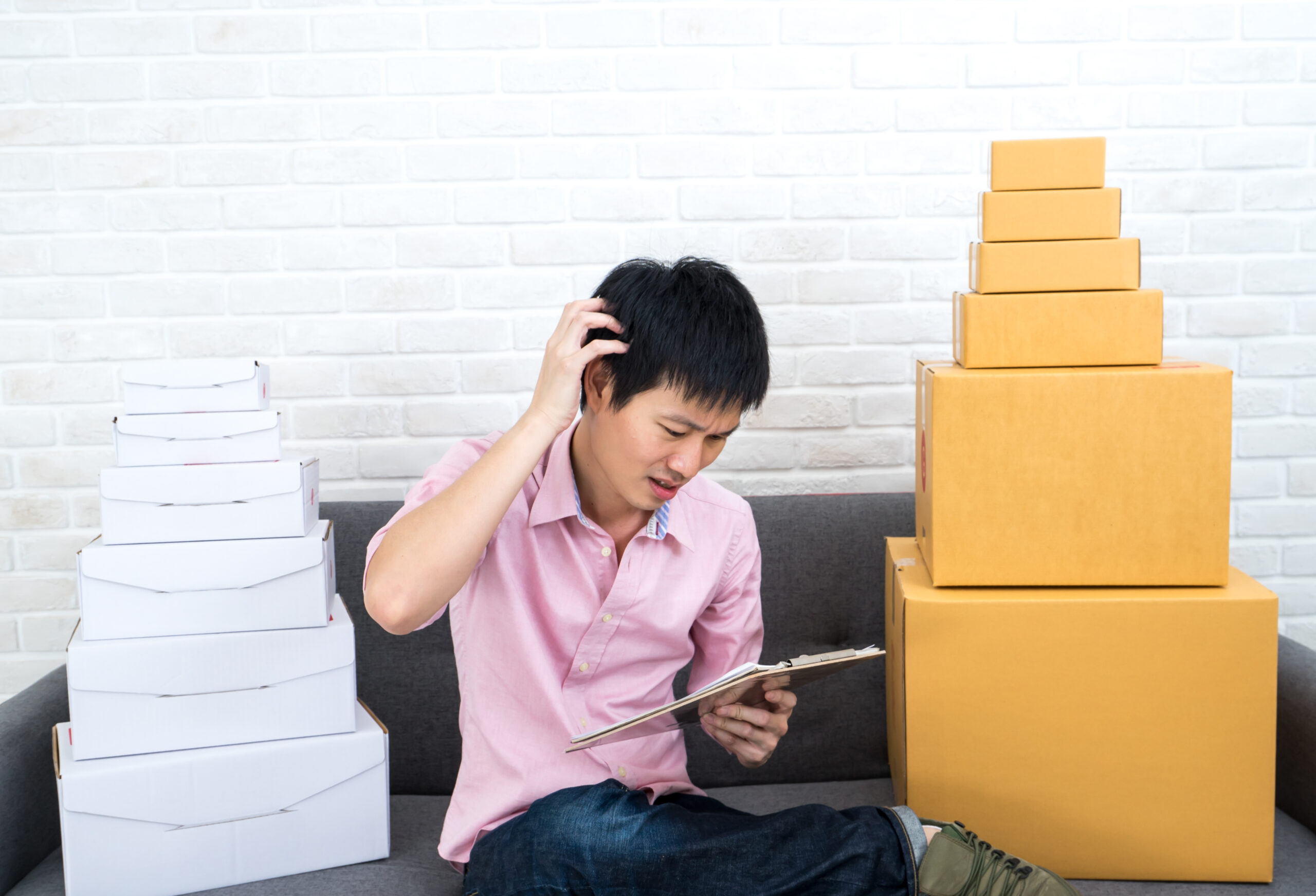 Asian man Stressed about business SME online