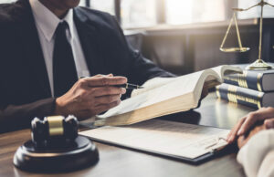 Court Had Jurisdiction to Award Attorney Fees Though Expressly Denied Prior to Judgment Businesswoman and Male lawyer or judge consult having team meeting with client, Law and Legal services concept.