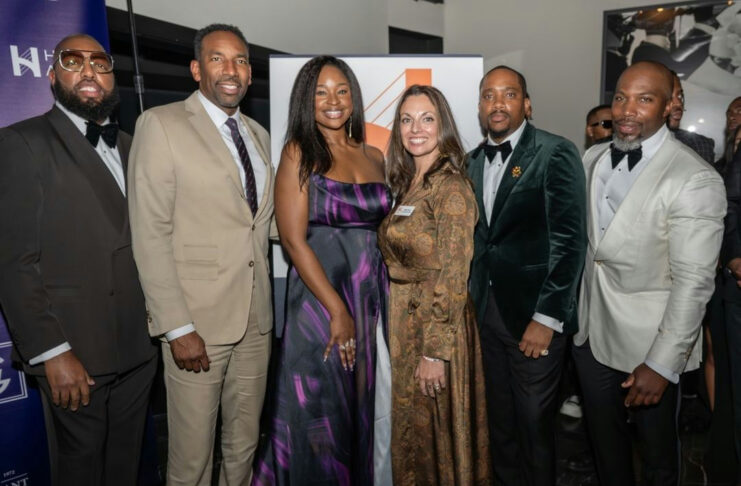 Photo shared by City Of Atlanta on November 21, 2024 tagging @mckcares. May be an image of 7 people, people standing, magazine, carpet, dinner jacket, night and text.