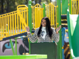 Discover the Grand Opening of Singleton Park: A New Community Hub for Fun, Connection, and Inclusive Growth in Norcross! Photo by Nicole Love Hendrickson on October 15, 2025. May be an image of child, smiling, slide, park and text.